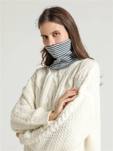 Close-up detail of the knitted texture on a blue and white striped neck warmer