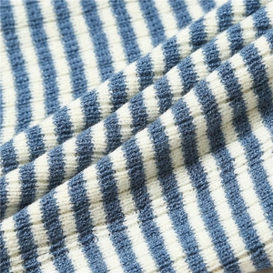 Detail shot of blue and white striped knit fabric with soft ribbed texture and pattern