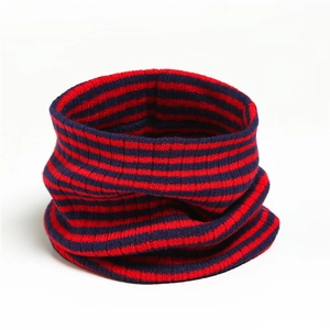 Detail of red and blue striped knit gaiter showing ribbed texture and fabric elasticity