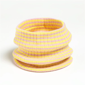 Detail of pink and yellow striped knit neck warmer with ribbed texture and elastic design