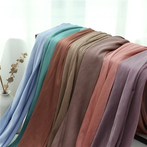 Multi-colored crinkled chiffon scarves set in diverse soft tones for elegant styling