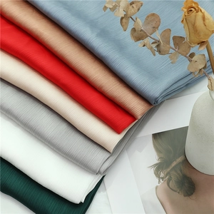 Detail shot of multi-color pleated chiffon scarves featuring high-quality vertical texture