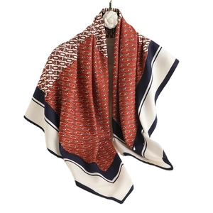 Silk square scarf featuring navy and red geometric chain pattern with elegant drape
