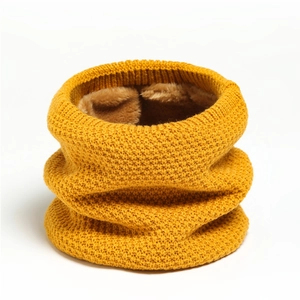 Detail of ginger knitted neck warmer showing thick soft faux fur lining and texture