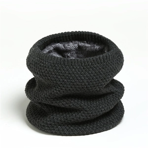 Close-up of the honeycomb knit texture and thick grey fleece lining of the snood scarf
