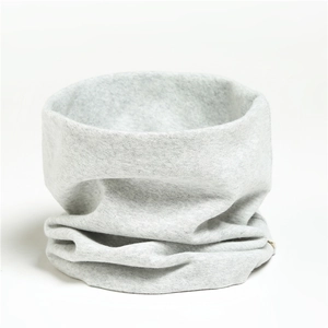 Detailed view of light grey knitted neck warmer showing soft ribbed cotton fabric texture
