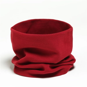 Detailed view of elastic red cotton neck warmer showing soft fabric texture and seamless design