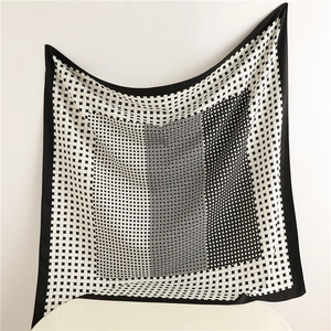 Classic black and white checkered silk square scarf with geometric weave patterns