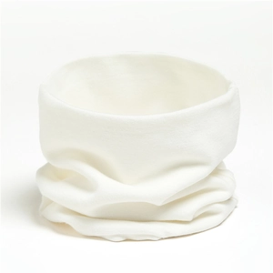 Detailed close-up of soft white knitted cotton neck warmer showing fabric texture