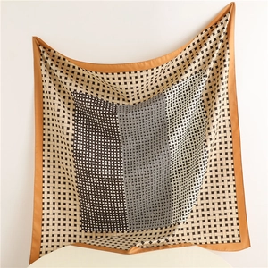Plaid weave silk scarf in brown and white satin fabric shown hanging in full view