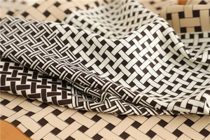 Close-up of woven geometric lattice pattern on high-quality twill silk scarf fabric
