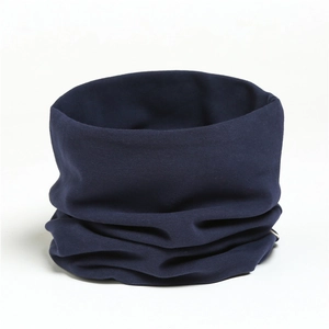 Close-up of a soft navy blue cotton neck warmer showing seamless knit texture and folds