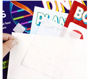 Detail view of transparent adhesive dots on backing paper for biology posters