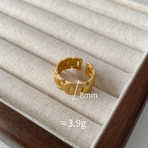 Detailed view of 8mm wide gold chain ring with adjustable opening and matte finish