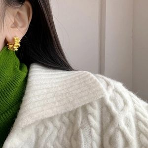 French vintage matte gold twisted hoop earrings showing irregular pleated spiral design