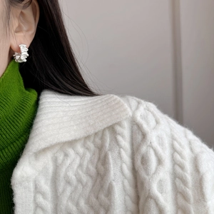 French vintage matte silver hoop earrings with irregular folded texture on a model