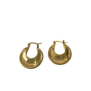 Polished gold crescent hoop earrings with a minimalist arc design and glossy finish