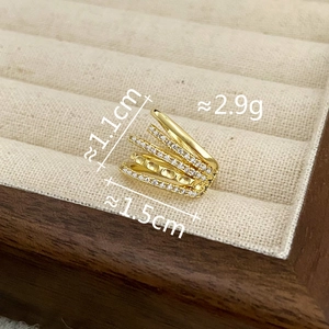 Detailed view of gold double-layer ear cuff with zircons, size 1.1cm by 1.5cm