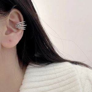 Sparkling silver layered ear cuff with zirconia stones on model for non-pierced ears