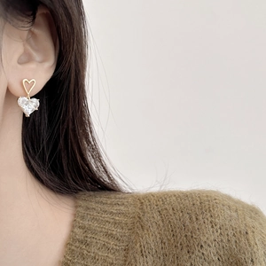 Elegant gold-plated open heart earrings with dangling clear heart-shaped zircon stones