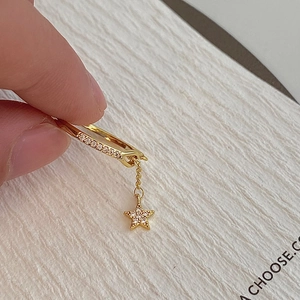 Elegant gold-plated star earrings with sparkling zircon dangles and hinged hoop design