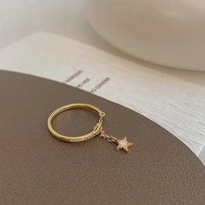 Elegant gold star zircon chain ring featuring a dangling star charm and micro-inlaid stones
