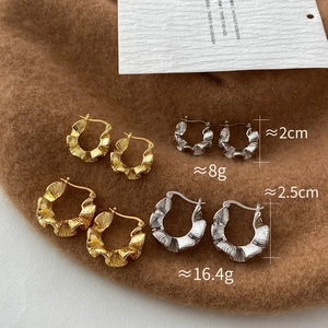 Detailed comparison of gold and silver textured C-shaped hoop earrings in two sizes