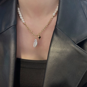 Asymmetric necklace with freshwater pearls, baroque pendant and gold heart charm