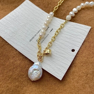 Baroque pearl necklace with gold chain and heart pendant, half-and-half jewelry design