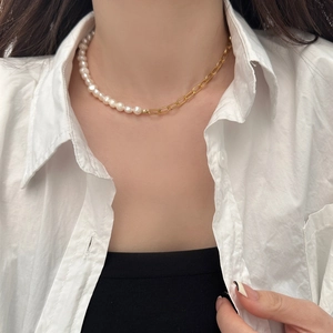 Detailed view of French Baroque necklace with pearls and gold paperclip link chain