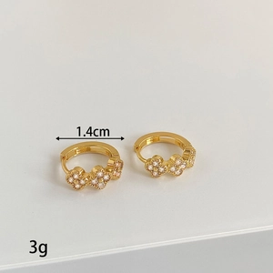 Detail view of 1.4cm gold earrings featuring sparkling zircon flower clusters and spring clasps