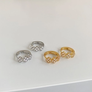 Elegant floral huggie earrings with cubic zirconia stones in gold and silver plating