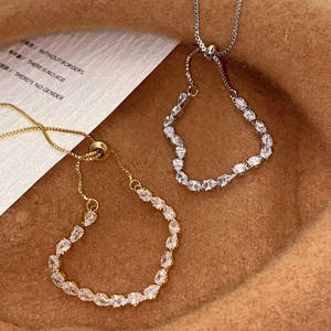 Elegant adjustable drawstring bracelet with sparkling pear-cut cubic zirconia in gold and silver