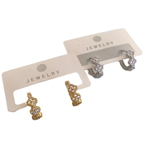 Elegant gold and silver clover hoop earrings with pavé cubic zirconia gemstones