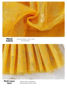 Detail of yellow tulle girls skirt featuring gold glitter stars and multi-layer fabric