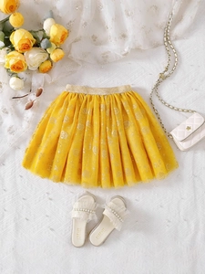 Girls' bright yellow tutu skirt with gold elastic waistband and sparkling prints