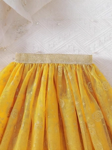 Girls bright yellow sequin tulle skirt with gold stars and moon patterns