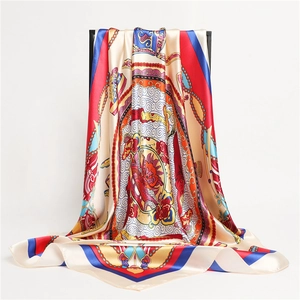 Detail of silk scarf with classical oriental patterns and vibrant golden chain motifs