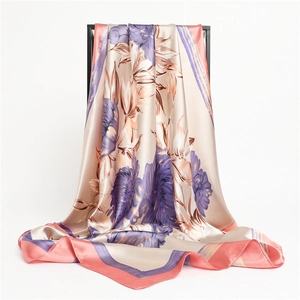 Detail of floral silk scarf showing smooth texture and elegant purple flower prints