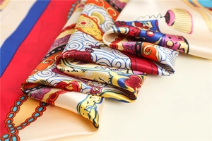 Close-up of silk-textured scarf showing intricate oriental patterns and vibrant floral prints