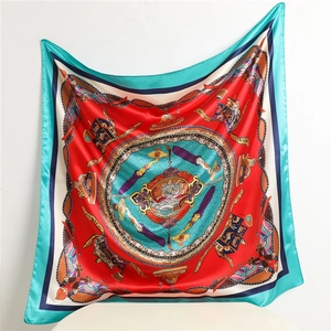 Detail of red Chinese style silk scarf with dragon totem and classical patterns