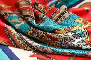 Macro shot of silk scarf showing vintage Chinese prints and smooth fabric texture