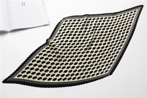 Detail of accordion pleated scarf with black and white geometric pattern and crinkled texture