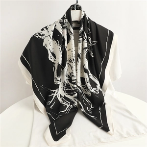 Elegant large silk scarf with black and white abstract art texture on white t-shirt