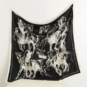 Detailed view of large square silk scarf with dynamic white horse line art on black