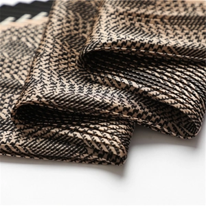 Pleated houndstooth silk scarf in gold and black with fine wrinkled texture details