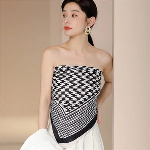 Detail of silk square scarf with houndstooth pattern styled as a creative tube top