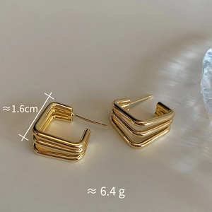 Detail of gold geometric triple-layered square stud earrings with 1.6cm size dimensions