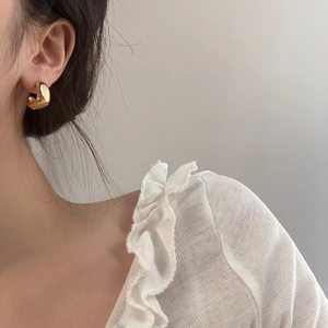 French geometric gold C-shaped hoop earrings with a high-polished mirror finish