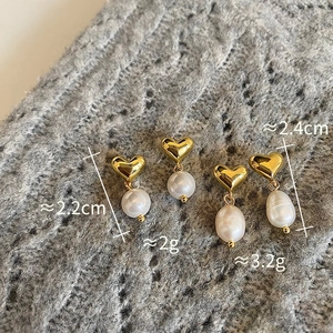 Detail showing gold heart stud earrings with freshwater pearls and measurement data